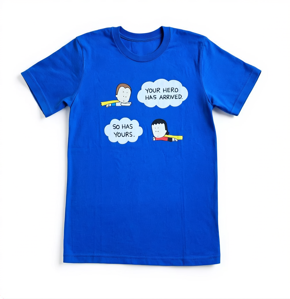 Blue t-shirt with cartoon graphics and text on a white background