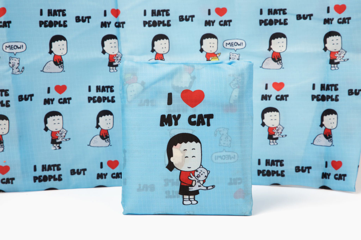 This high quality, rip stop nylon shopper bag with an all over pattern of "I Hate People, but I Love My Cat," is extra large and sturdy. It can be folded into its pocket so you can neatly and conveniently carry this shopper bag in your purse or car. Approximately 25 inches tall by 15 inches wide. When folded into its pocket, it measures 5 x 4.5 inches.