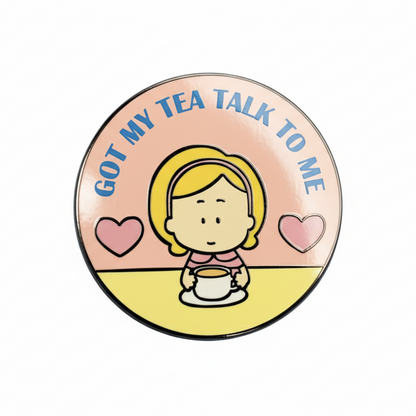 Enamel pin with Deborah, a cartoon character drinking tea and the text 'GOT MY TEA TALK TO ME' on a pink background with heart shapes.