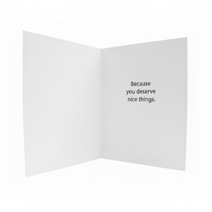 Open beige card with black text on a white background